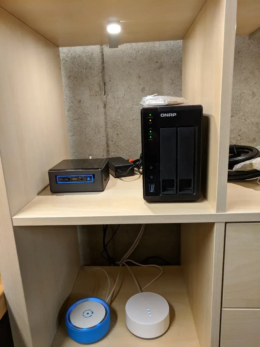 Tower server on a shelf above two wireless access points.