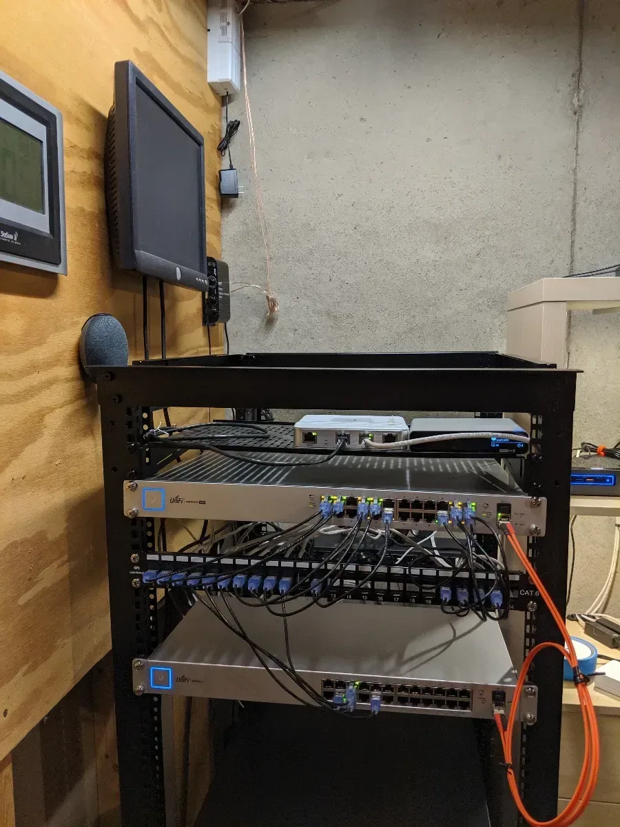 Partially rebuilt rack with patch panels and network equipment installed.