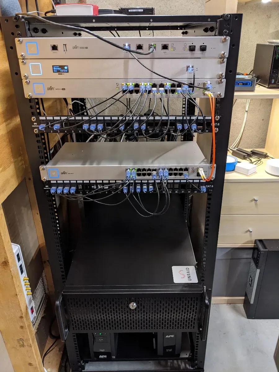 Completed rack with network equipment and rackmount storage hardware.