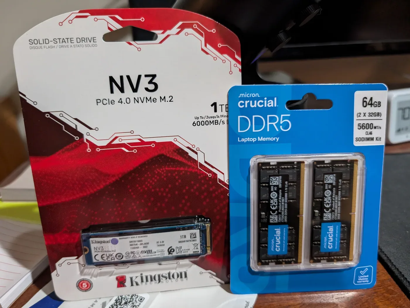 NVMe solid-state drive and 64 GB DDR5 memory kit prepared for a homelab node upgrade.